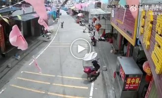 A strong Chinese teenager rode on a rear wheel