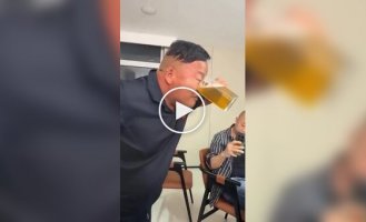 A man drank beer through his nose