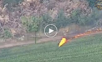 A motorized assault occupier hit by a drone races on a burning motorcycle, leaving a fiery trail