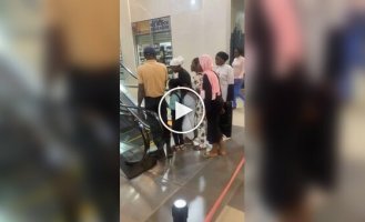 A woman's painful encounter with an escalator