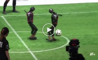 Beijing AI robots play 3-on-3 football