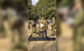 The Japanese Defense Minister and an army backpack