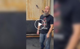 Right on target: man expertly throws knives and axes