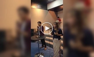 A guy uses an app on a smartphone instead drums
