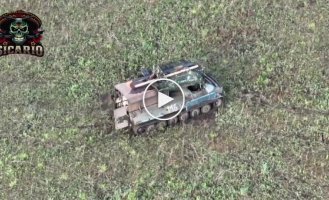 The body of the Russian invader completely burned along with the armored vehicle that our soldiers hit