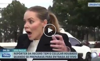 Brazil: thief on bicycle steals reporter's phone live on air