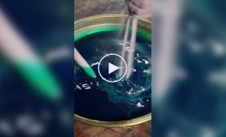 Sand harmony: the process of creating a mandala from colored sand.