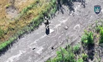 The body of a Russian invader burns after an attack by Ptakhiv Madyar