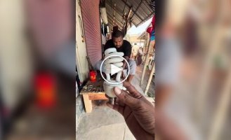 Turning a burnt-out light bulb into an oil lamp