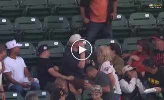 A guy caught a ball and gave a girl an unforgettable gift