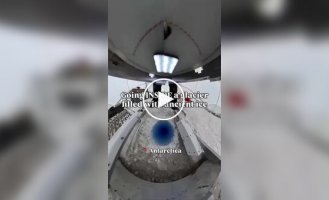 In Antarctica, a photographer sent a camera deep into an ancient glacier, attaching it to a drilling rig