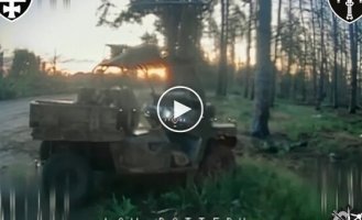 FPV drone destroyed enemy ATV parked on the edge of the road in the forest belt