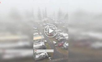 In Australia, a crane broke in half and has been hanging over a tourist park for several days