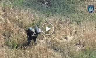 Pieces of an occupier fly in different directions after being hit by a drone