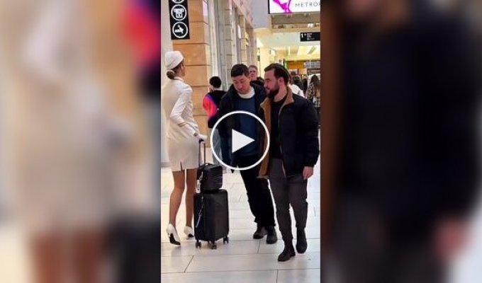 Funny reaction of people at the airport to a tall stewardess
