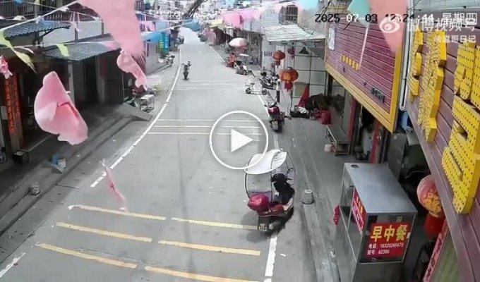 A strong Chinese teenager rode on a rear wheel