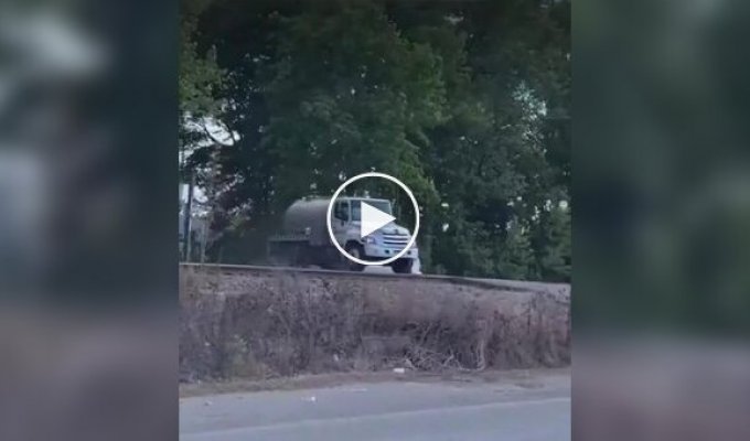 A sewage truck was epically crushed by a train in the US