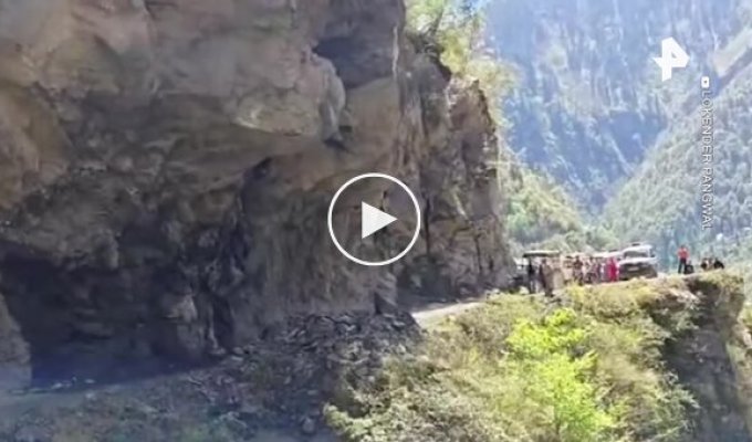 Rock collapse onto a road in India