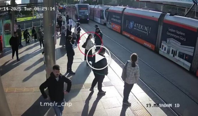 A security officer saved an inattentive woman at the last moment