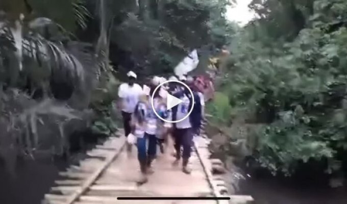 A wooden bridge collapses during a grand opening in Congo
