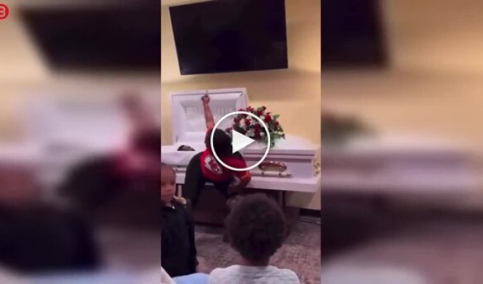 A woman twerked next to a coffin