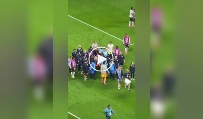 An England footballer was carried off the field on a stretcher after celebrating his victory.