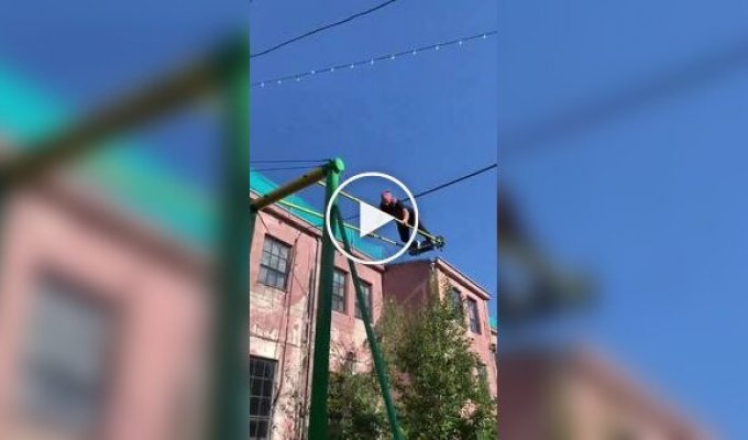 What children in the courtyards dreamed of: a man spun around on a swing