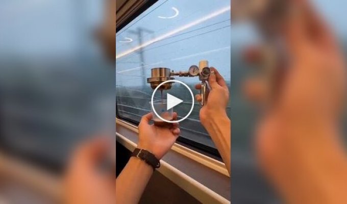 A Chinese man makes coffee on the way to work right on the train
