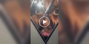 In England, an unknown person looked through the glass door of a house at night