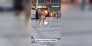 Two girls danced in sync on the square to the music of a street musician in Ireland